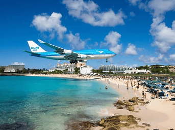 A plane coming in over Moho Beach, Sint Maarten